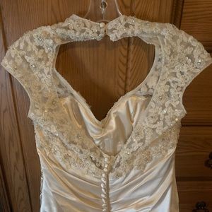 Wedding dress. Size 12. Off white. Worn for 6 hours.